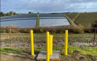 a Monitoring well in front of an open field